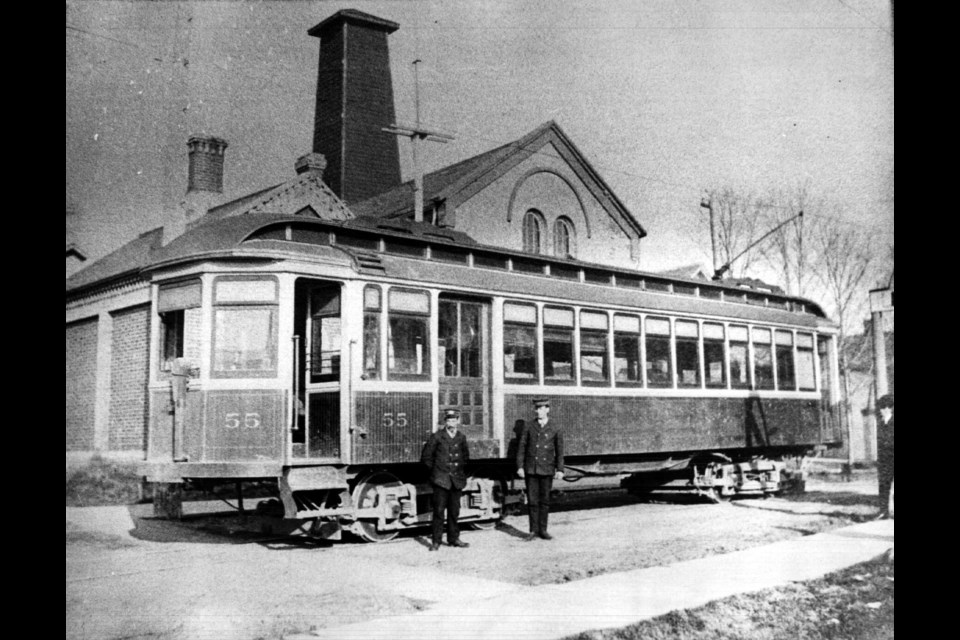 Car 55 at the top of Main Street, with the firehall's hose drying tower visible in the background.