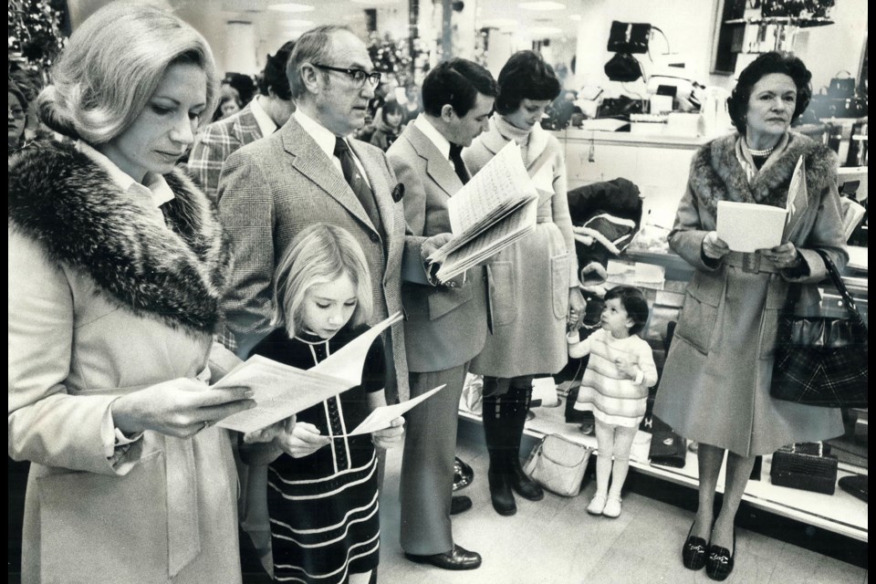 Carollers from Simpsons, with a young Frances MacLeod.