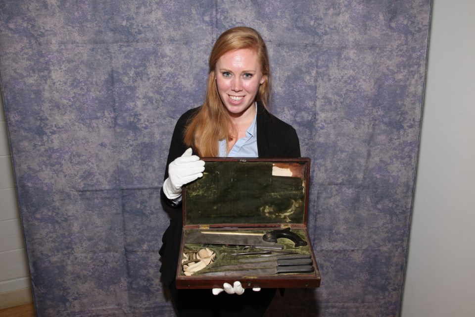Erika Baird, curator of Hillary House (Aurora Historical Society), brought Dr. MIchael Hillary's amputation kit that he used in the American Civil War on the Confederate side to the Newmarket HIstorical Society meeting Jan. 16. Greg King for NewmarketToday