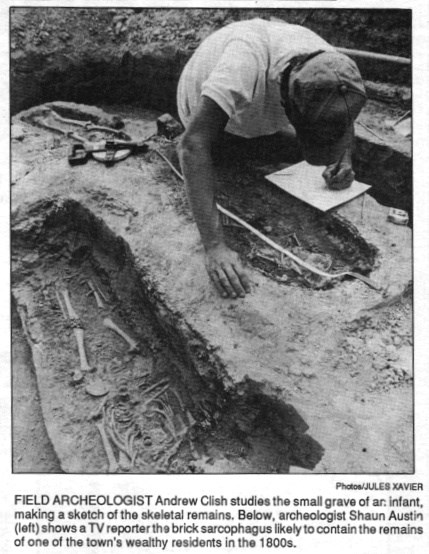 An archeologist studies the remains following their unearthing in 1989.