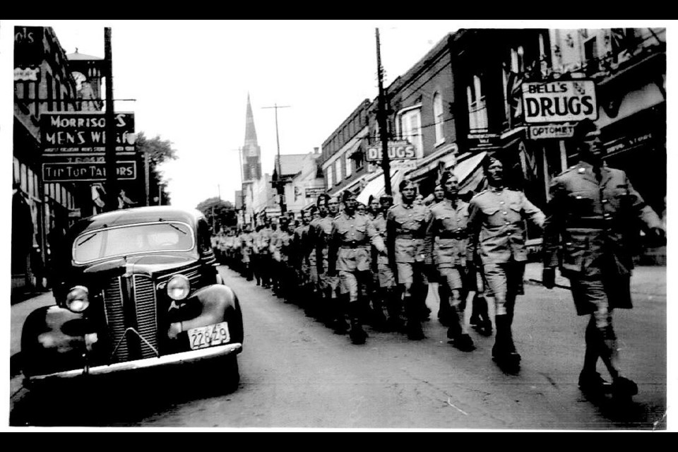 Soldiers march along Newmarket's Main Street.