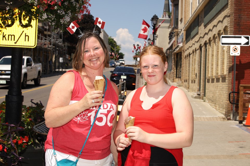 Now: Jodi Burch and daughter Brooke always celebrate Canada Day on Main Street, which was quiet this year due to COVID-19.  Greg King for NewmarketToday