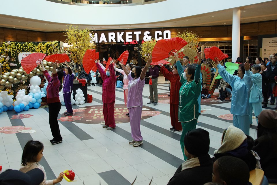 Seniors perform a traditional Chinese fan dance at Upper Canada Mall. 