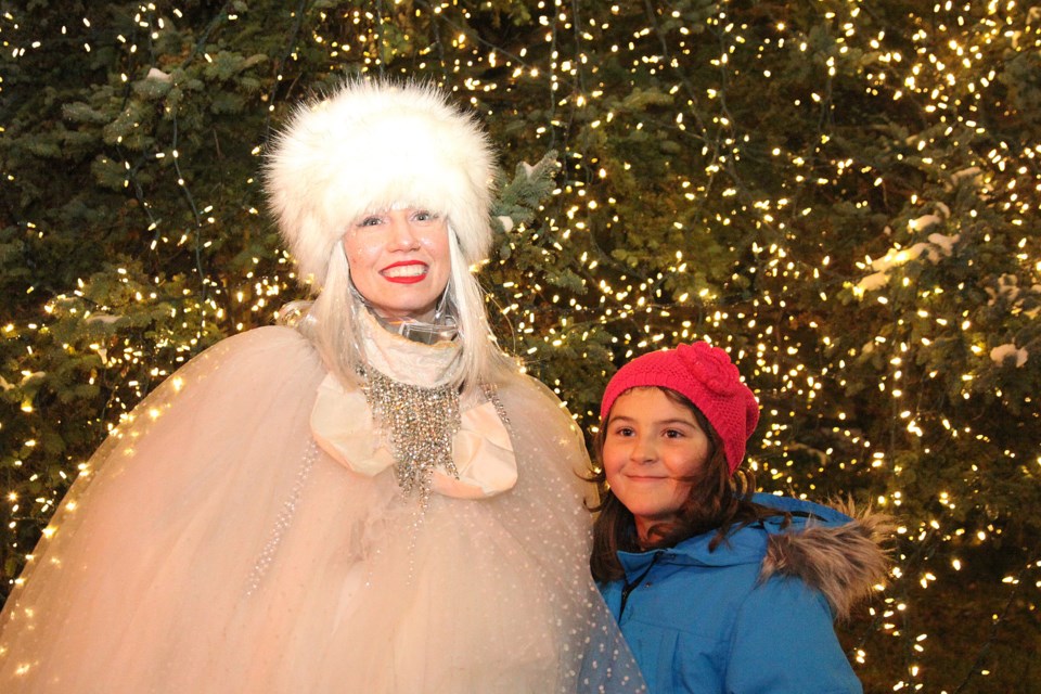 Maya Brethour with The Snow Queen at the festivities last night on Main Street.  Greg King for Newmarket Today