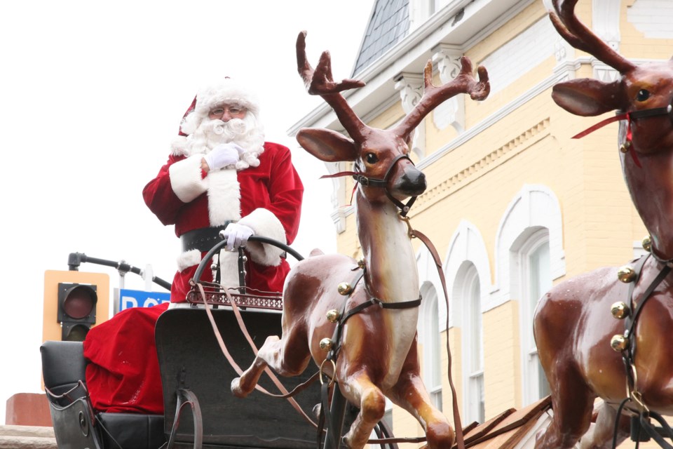 Saint Nick and his reindeer on Main Street at last year's Santa Claus parade.  Greg King for Newmarket Today