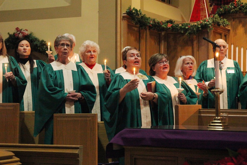 The Trinity United Church choir sings O Come, All Ye Faithful at the candlelight service Dec. 16.  Greg King for Newmarket Today