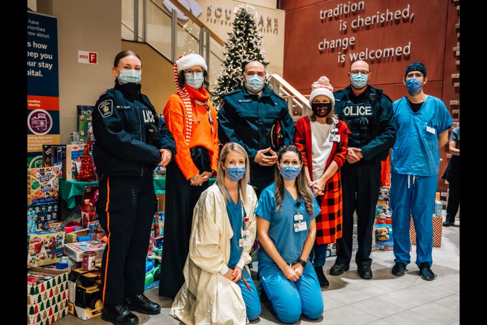 Southlake staff and members from YRP collecting the mountain of toys. 