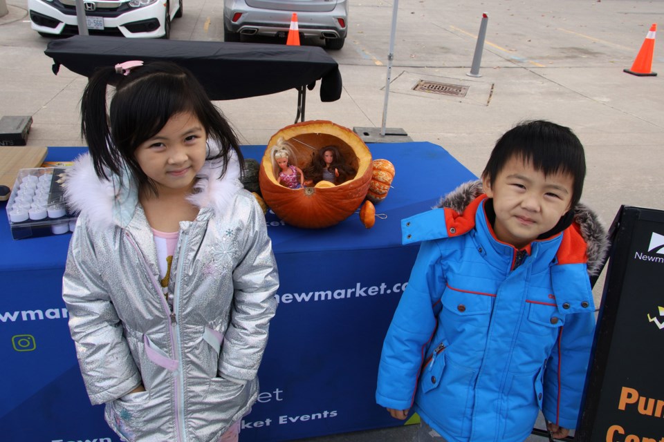 Halloween pumpkins got an extra day in the spotlight at the Town of Newmarket's annual pumpkin parade Nov. 1 at Riverwalk Commons. Keeva and Kyler Qu entered their Barbie pumpkin coach. Greg King for NewmarketToday