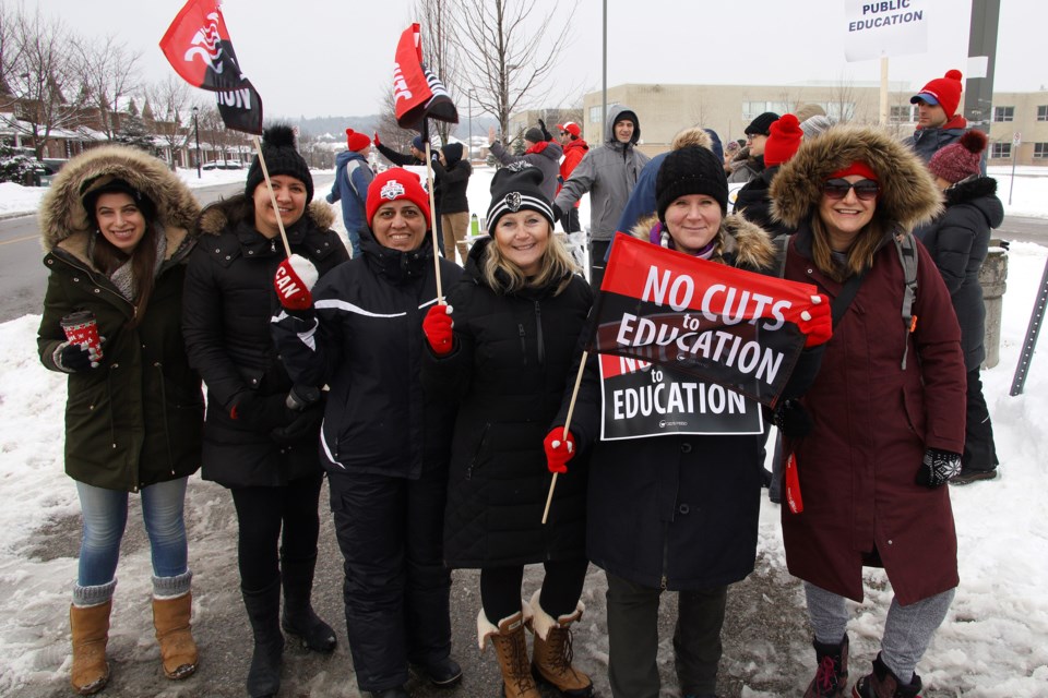 Sir William Mulock Secondary School teacher Julie Armstrong (second from right) said many members of the community are showing their support of OSSTF and the one-day strike, with even some dropping off coffee and doughnuts at the picket line.  Greg King for NewmarketToday