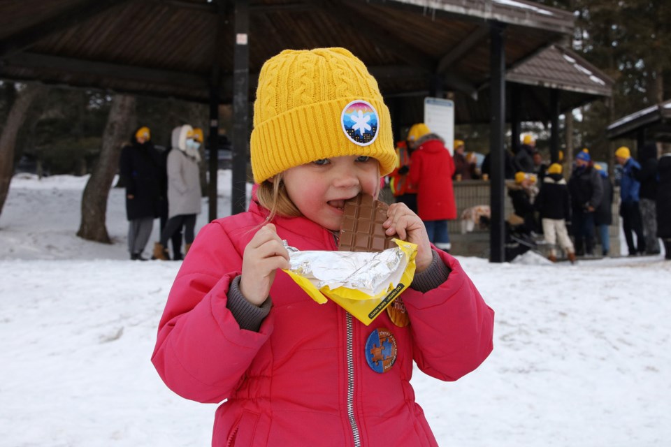 Millicent Playter enjoys a chocolate bar at the Coldest Night of the Year, in support of Newmarket's Inn From the Cold shelter for the homeless.  Greg King for NewmarketToday
