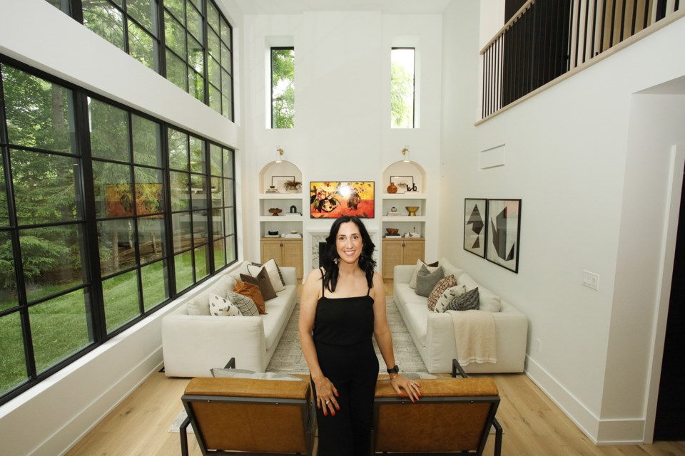 Designer Amanda Shields invited visitors to her home for the CFUW Home and Garden Tour June 11 in support of scholarships for women. An extensive build/renovation created a new modern space in the 1960s house, including a great room with floor-to-ceiling windows that emphasize the two-story cathedral ceiling.  Greg King for NewmarketToday