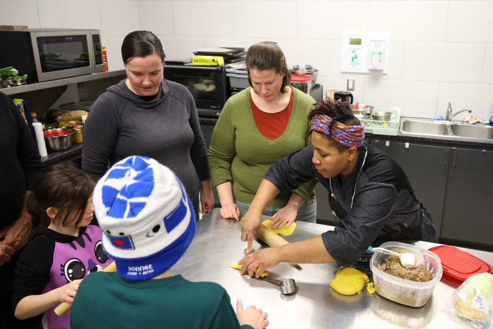 Chef Maxine Knight, culinary program director for York Region Food Network, shows how to make Jamaican patties at an evening of Afro-Caribbean cooking and storytelling at the Newmarket Recreation Youth Centre and Sk8te Park Feb. 21.  Greg King for NewmarketToday