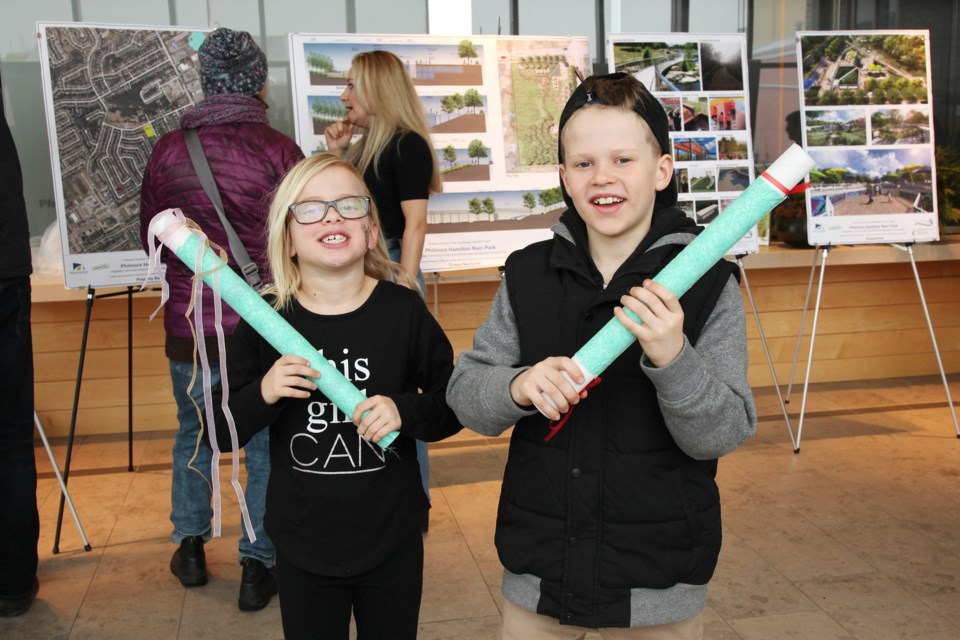 Amelia Jay and Ethan Gibson with the rain sticks that they made.  Greg King for Newmarket Today