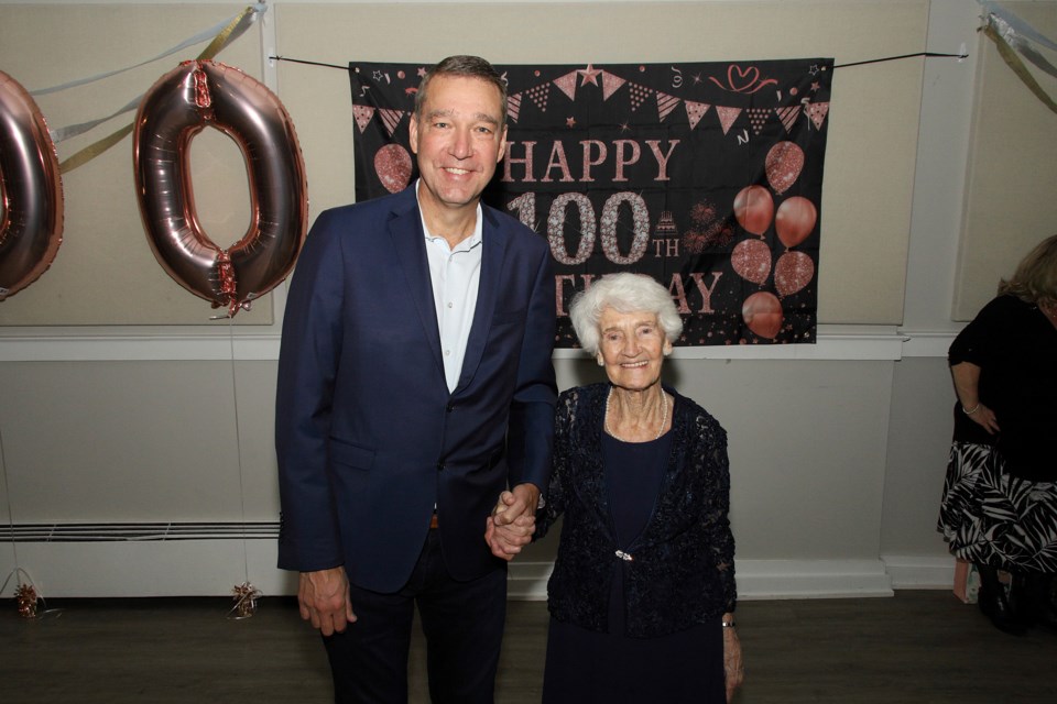 Newmarket Mayor John Taylor gives his best wishes to Ella Allison at her 100th birthday party at the Newmarket Veterans Association Saturday night.  Greg King for NewmarketToday