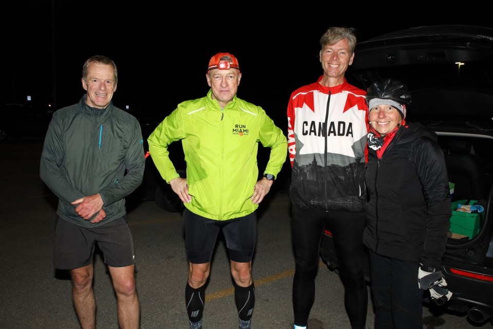 Han Koren, Paul Weston, Evert Akkerman, and Liisa Alton at 1 am.  Han just finished accompanying Paul on his 11 p.m. run and Evert will join Paul on his next run.  Greg King for NewmarketToday