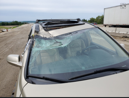 The driver of this vehicle travelling southbound on Highway 400 today was lucky not be injured when tires from a transport truck hit the passenger side of the front window. Supplied photo/OPP