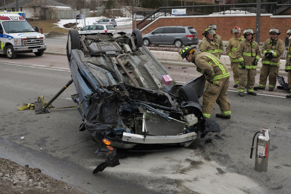 A driver fled the vehicle, while a female passenger remained trapped, following the single-vehicle collision on Davis Drive today. Greg King for NewmarketToday               