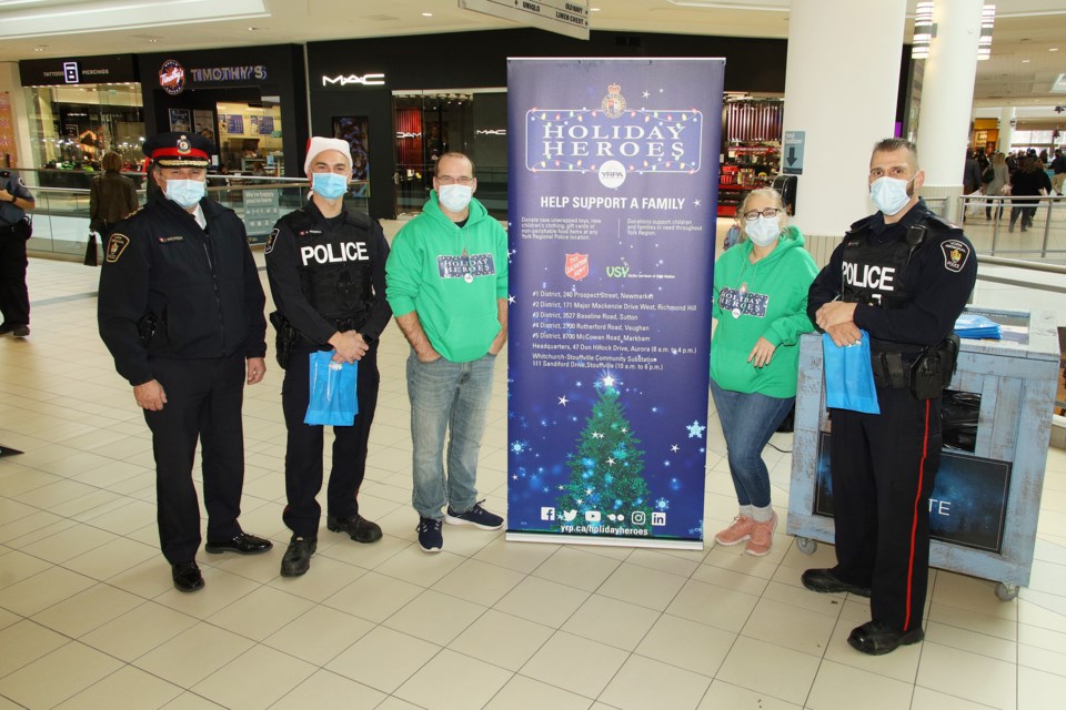 York Regional Police held its Holiday Heroes toy and food drive at Upper Canada Mall Dec. 4. Donations go to the Salvation Army and Victim Services York Region. They will also be there Dec. 5. Left to right: Chief Jim MacSween, Constable Rob Vanspall, Robin Coombs, Joanne Revensky, and Constable Rob Sorbera. Greg King for NewmarketToday