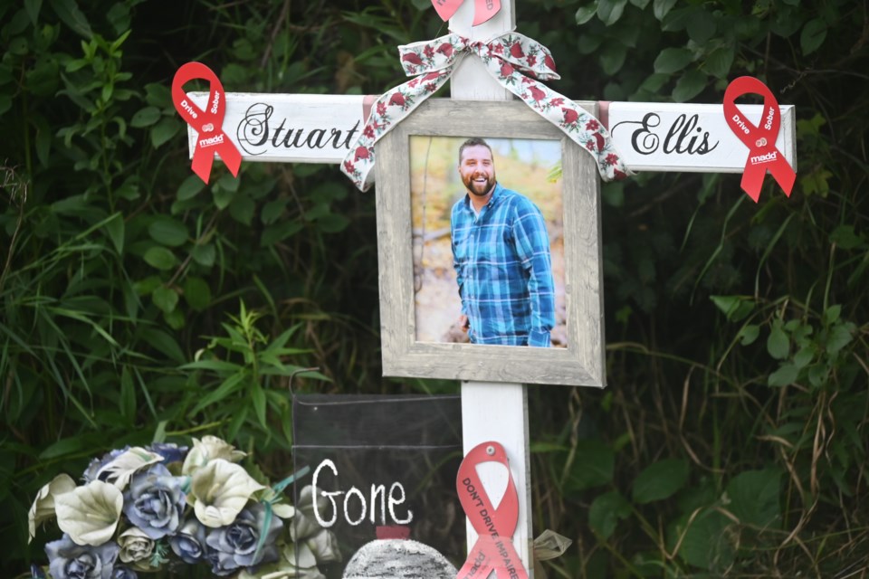 A memorial dedicated to Stuart Ellis, who was killed by a drunk driver on Highway 48 in 2017.