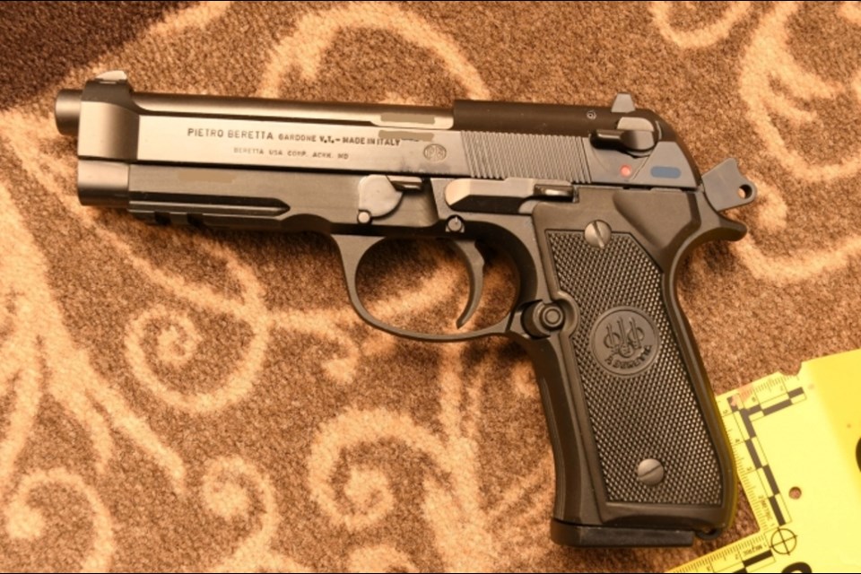 Beretta Model 92A1 9mm pistol with one round in the chamber and nine rounds in the seated magazine. The pistol used by the shooter was located on the carpeted hallway floor of the condominium building.