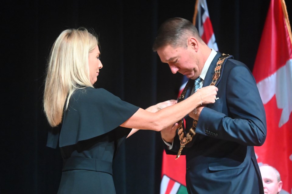 Newmarket Mayor John Taylor accepts the chain of office from town clerk Lisa Lyons at the inauguration of council Nov. 15 at the Old Town Hall. 