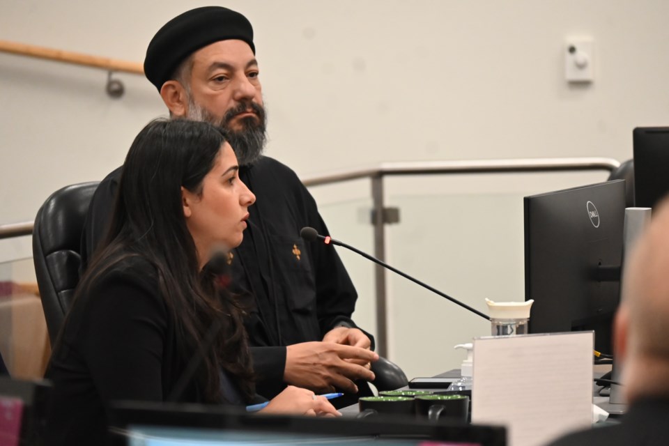 Malone Given Parsons principal Lauren Capilongo speaks to council about a new rental apartment proposal on Yonge Street alongside Father Pishoy Salama. 