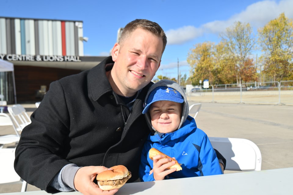 Matthijs van Gaalen, senior and junior, enjoy the Dawn Gallagher Murphy community barbecue Oct. 22. 