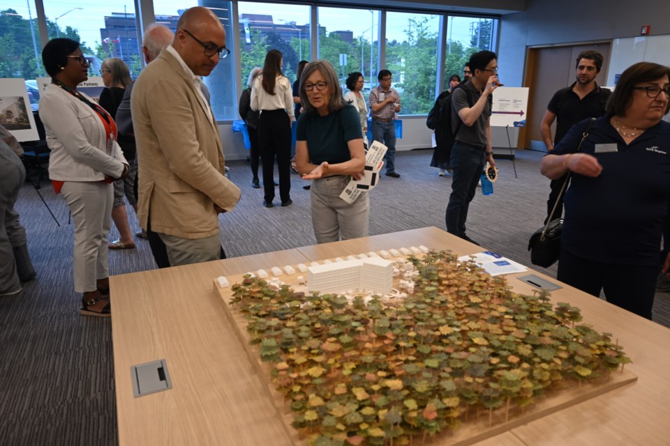 SvN Architects + Planners principal Sony Rai (left) stands by a scale model of the proposed development at 62 Bayview Pkwy. in Newmarket.
