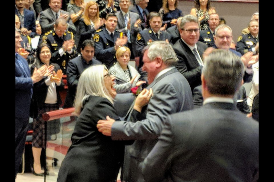 Newly re-elected regional Chair and CEO Wayne Emmerson embraces Chief of Staff Lina Bigioni after winning the seat. Kim Champion/NewmarketToday