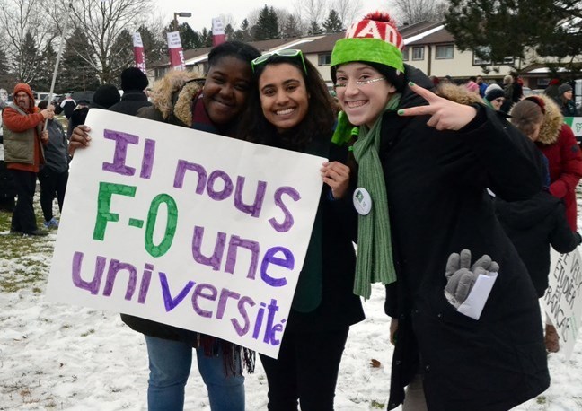 Richmond Hill students Bintou Saye, Anaïs Beharry and Kim Nixon demonstrate in front of York-Simcoe MPP Caroline Mulroney's office Saturday, protesting cuts to French-language services in Ontario. Patrick Bales for NewmarketToday
