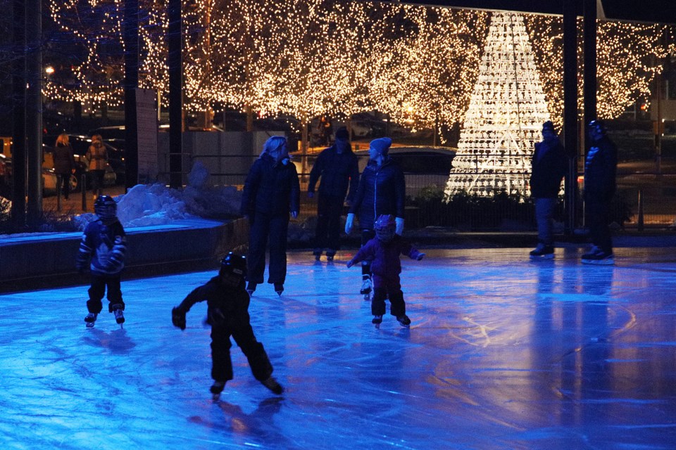 Residents skate among the lights at Riverwalk Commons during their pre-booked time.  Greg King for NewmarketToday