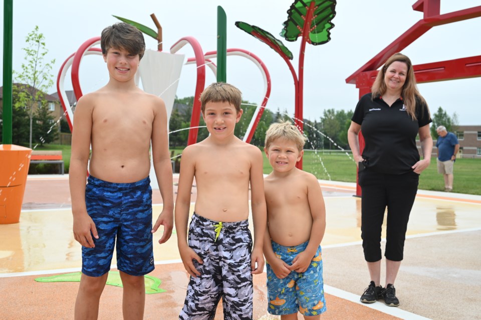 Nicholas Young, Jonathon Kyte and Lucas Kyte alongside Councillor Kelly Broome at the opening of the fully accessible splash pad at Dr. Margaret Arkinstall Park July 13.