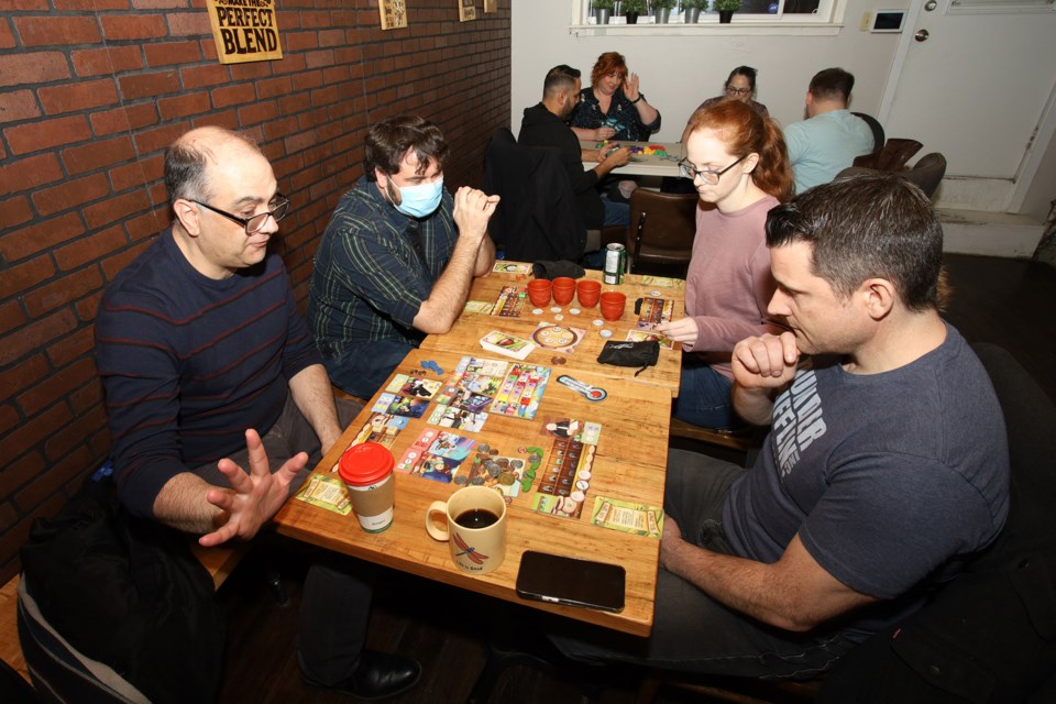 Vincent, Bobbi, Lacey, and Jay play Chai.  Greg King for NewmarketToday