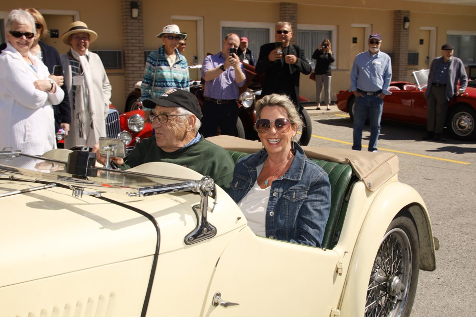 Gathering of the Ontario Faithful founder Bob Bruno takes Councillor Jane Twinney for a spin in his MG TC at the car show Saturday in Newmarket.  Greg King for NewmarketToday