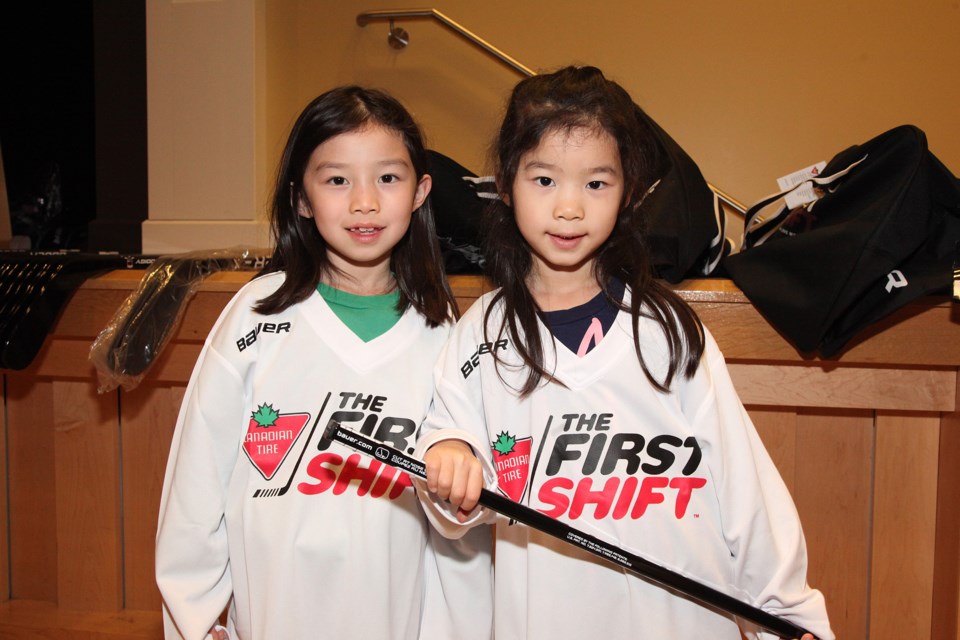 Sisters Clara and Emma Zhou get a fun introduction to hockey at the Canadian Tire First Shift last night at the Old Town Hall.  Greg King for Newmarket Today