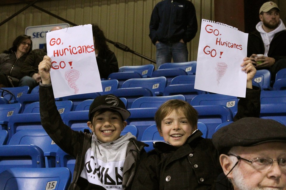 Young fans Preston Peddle and Ethan Taylor cheer on the Hurricanes during the playoffs.  Greg King for NewmarketToday