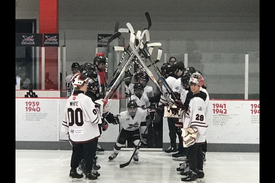 The York Simcoe Express Novice team takes to the ice for its first full ice game Jan. 25, with the Minor Midgets there to cheer them on. Supplied photo/York Simcoe Express