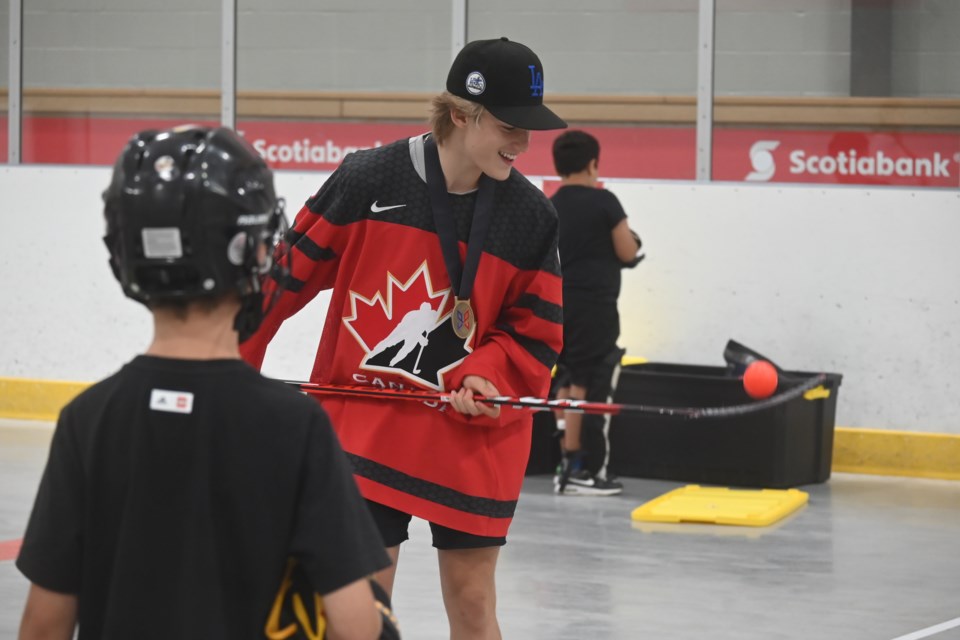 Denver Barkey shows off some skills to the kids at Newmarket's Hockey Camp Sr. 