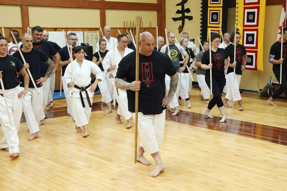 Sensei Tuari Dawson comes to North America for the first time from New Zealand for Budo Without Borders in Newmkaret Oct. 1 Here, he leads the group in the haka he just taught them.  Greg King for NewmarketToday