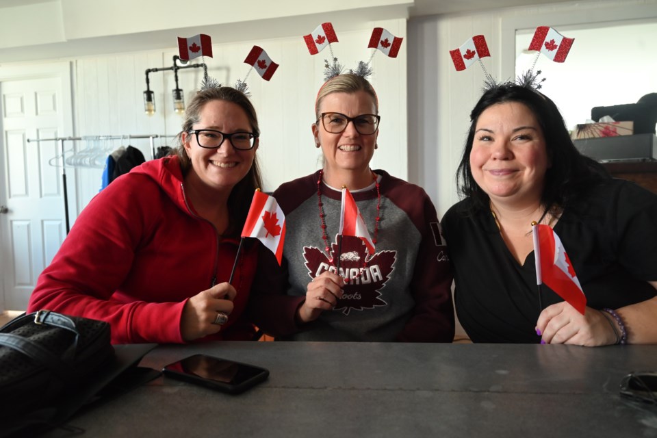 Sarah Howson, Catherine Rae and 
April Jones were ready to cheer on Canada at the World Cup during a viewing party by the Newmarket Soccer Club. 