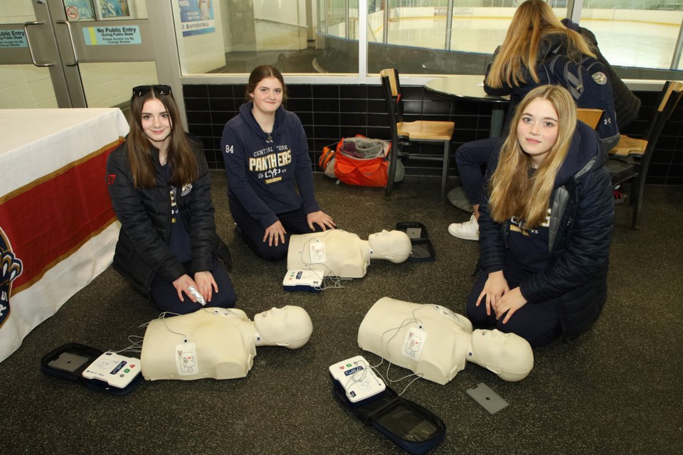 Kaia Higgins, Sydney Little, and Avery Specce from the U15A team learn about CPR.  Greg King for NewmarketToday