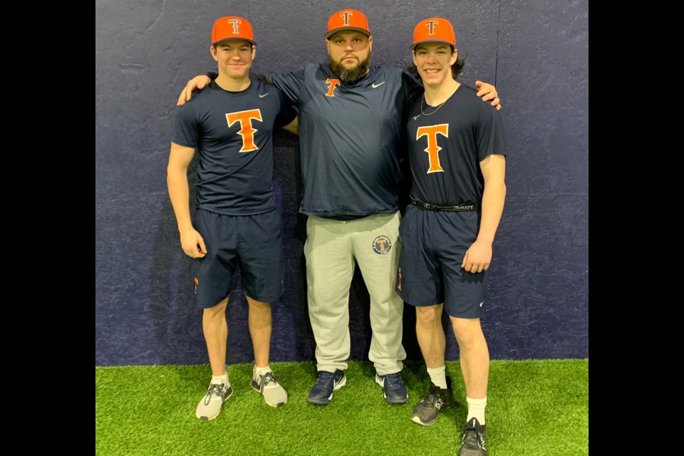 Newmarket Titans players Cameron Byers (left) and Nolan Thomson with head coach 18U Denis Bailey.