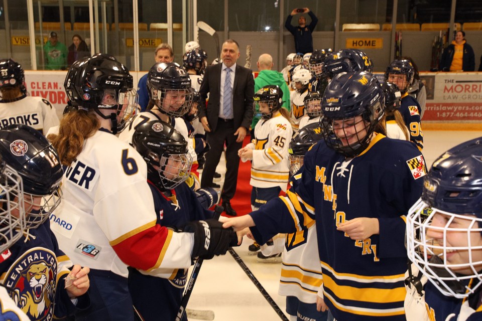 Central York Panthers U9 and U11 players exchange pins with the Montgomery Ice Devils at the kickoff of the 34th annual International Silver Stick tournament this weekend at local rinks in Newmarket and Aurora. There are 56 teams from across the continent in attendance.
 Greg King for NewmarketToday