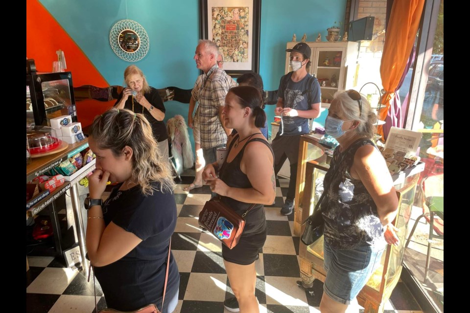 Close to 20 people showed up at Coming Home for a 'dessert and coffee flash mob' organized through Facebook by Greens & Beans owner Leona Green.