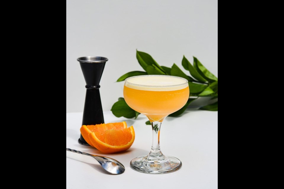Take a sip of  Charizard Chillin’, a tequila-based cocktail themed on the Pokémon Charizard, at Moodswing Coffee and Bar's pop-up