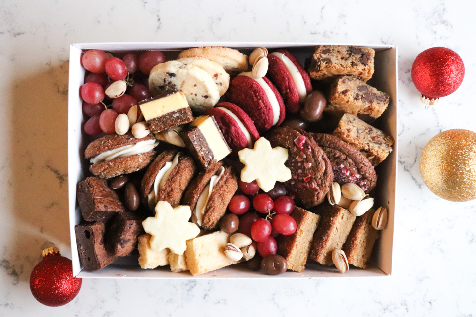 Trove Desserts' Holiday Dessert Box includes an assortment of treats including ginger eggnog sandwich cookie and candy cane brownie cookie. 