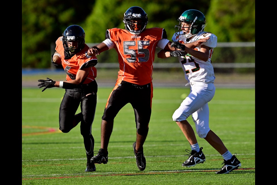  EJ Hansraj blocks for Nikolas Panesar of the Jr. Varsity New Westminster Hyacks, during their home opener against the Mariners. Photo: Jennifer Gauthier