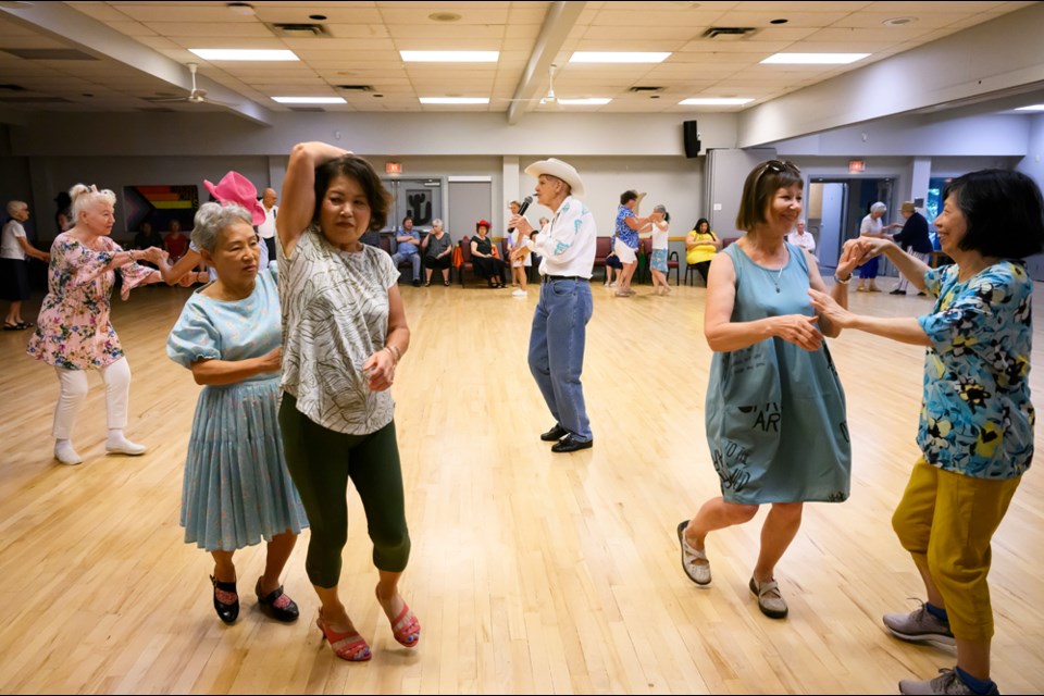 Darlene Currie guides dancers through the steps at the Century House Seniors Gay Straight Alliance annual Pride Hoedown. Photo: Jennifer Gauthier
