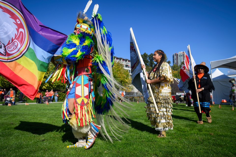 David Whitebean, Rubiya whitebean and Chief Rhonda Larrabee lead the grand entry.