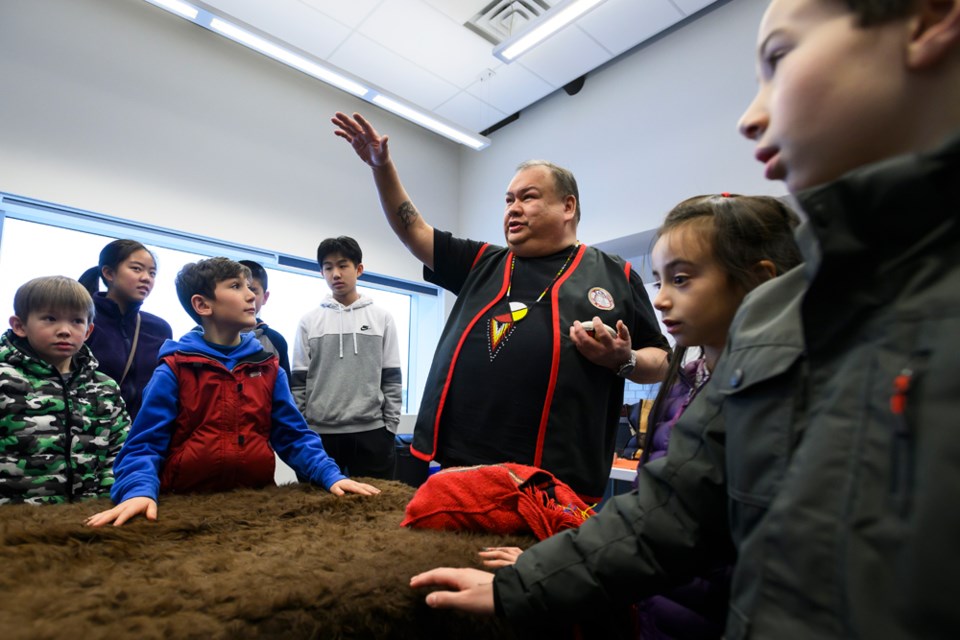 Cree knowledge keeper and Spirit of the Children Society's Youth Enhancement Program Manager, Ernie Cardinal, teaches participants about the medicine wheel during the Indigenous Cree Medicine Bag session at the Anvil Centre.